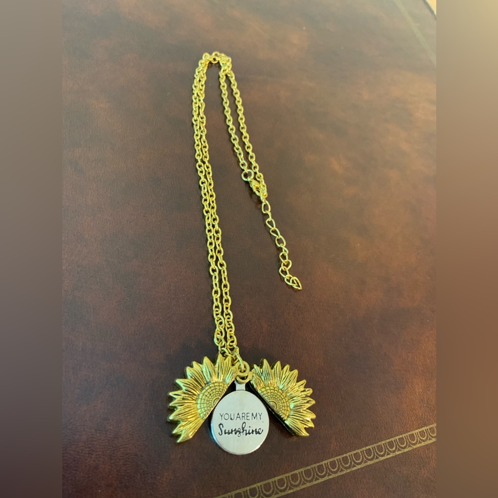 gold sunflower necklace that says  “you are my sunshine”